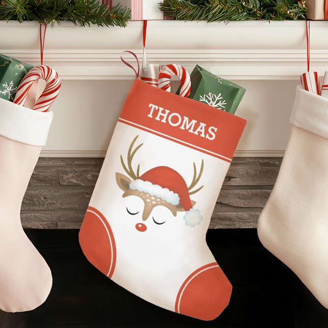 Calcetín Navideño Pequeño Monograma de renos de Navidades rojos (A cute Christmas reindeer decorates this Christmas stocking. Personalize it with your name.)