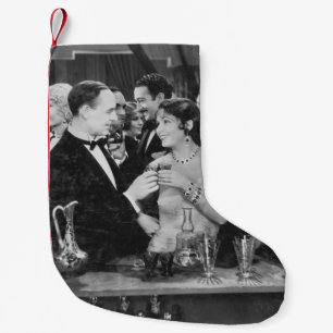 Calcetín Navideño Pequeño Pareja tomando algo en el concurrido bar