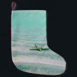 Calcetín Navideño Pequeño White starfish on sand underwater in the morning<br><div class="desc">White starfish on sand underwater in the morning</div>