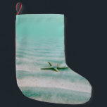 Calcetín Navideño Pequeño White starfish on sand underwater in the morning<br><div class="desc">White starfish on sand underwater in the morning</div>