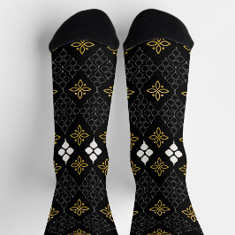 Calcetines Black socks featuring a gold and white pattern 