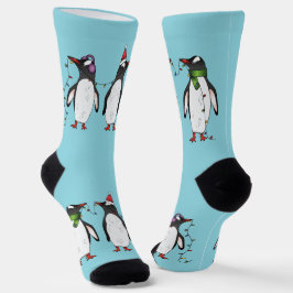 Calcetines Tres pingüinos navideños festivos sobre azul claro