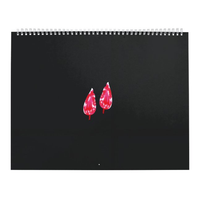 Calendario un par de hojas rojas sobre un fondo negro (Tapa)