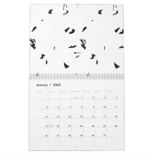 Calendario Una bandada de pájaros volando en el cielo.