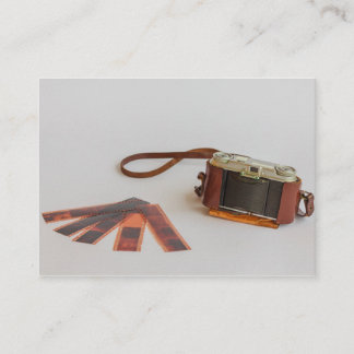 cámara antigua con tarjeta de visita negativa