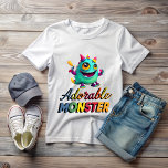 Camiseta Adorable Monster<br><div class="desc">The design consists of a funny and friendly gradient green monster, with several yellow and red jars that seem to come out of its head. His bulging, mischievous eyes, along with an adorable smile, give him a special charm. Complementing the design, a multicolored cursive sign reads "Adorable Monster." This design...</div>