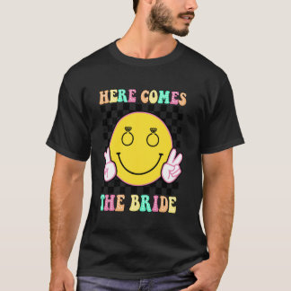 Camiseta Aquí viene la novia Té de fiesta de soltera groovy