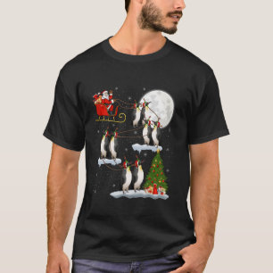 Camiseta Árbol de navidad ilumina el pájaro del penguín del
