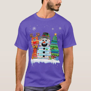 Camiseta Árbol de Navidad Snowman Reindeer libro Stack Tee