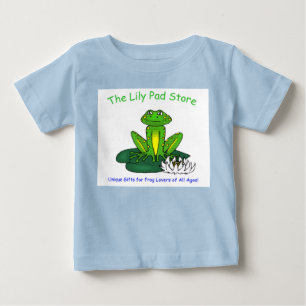 Camiseta azul blanca de rana de bebé en una hoja d