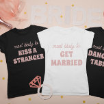 Camiseta Bachelorette Party Most Likely To Dance On Tables<br><div class="desc">This funny personalized bachelorette party "Most likely to dance on tables" t-shirt is the perfect way to celebrate the bride-to-be! The playful script and modern font create a trendy look, while the spacious back design provides plenty of room for additional personalization or group names. Whether you're hitting the town or...</div>