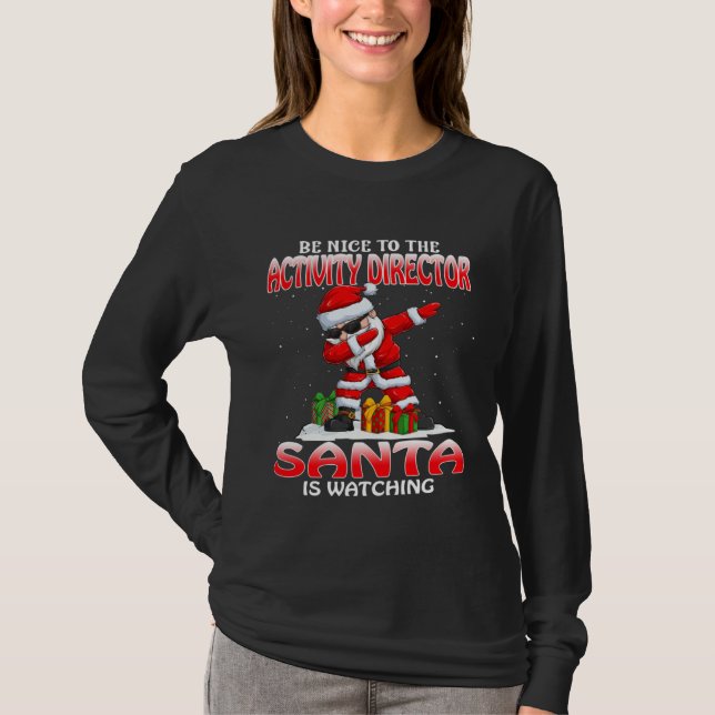 Camiseta Be Nice To The Activity Director Santa Is Watching (Anverso)