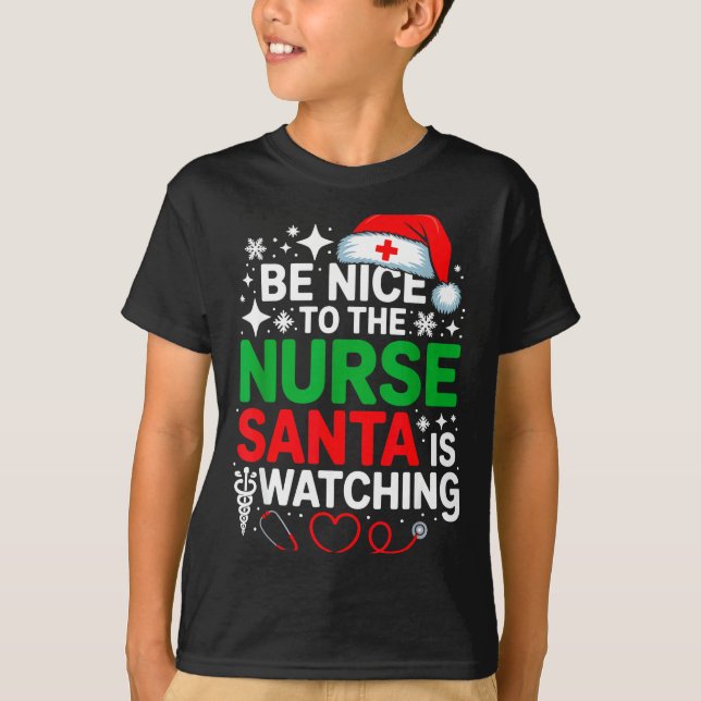 Camiseta Be Nice To The Nurse Santa Is Watching Funny Nurse (Anverso)