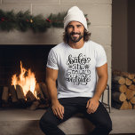 Camiseta Bebé, hace frío fuera del invierno<br><div class="desc">Una película caligráfica escrita a mano para el invierno,  con copos de nieve alrededor de un dicho: bebé hace frío afuera". Obtén uno para ti y para tu otro importante.</div>