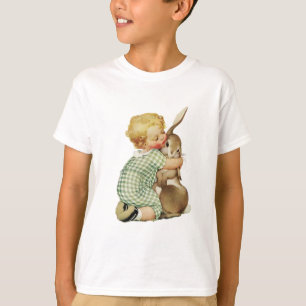 CAMISETA BEBÉ QUE ABRAZA EL CONEJITO DE PASCUA