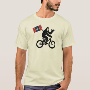 Camiseta Bigfoot en bicicleta con la bandera de Mississippi