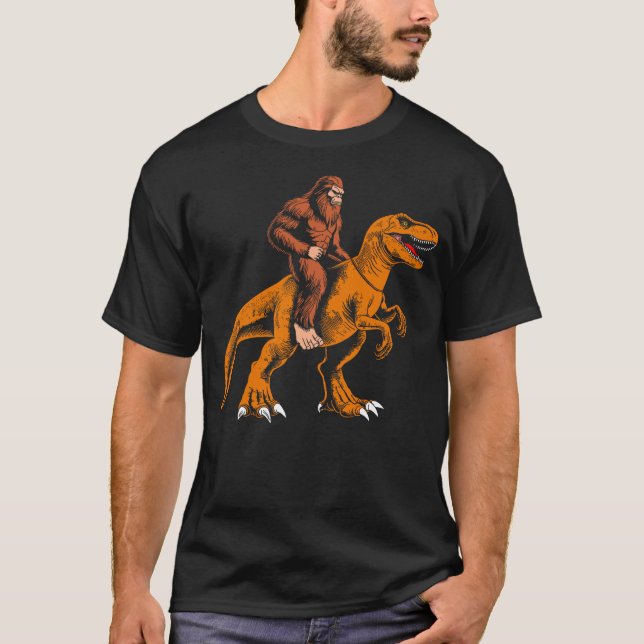 Camiseta Bigfoot riding dinosaur kids sasquatch riding t re (Anverso)