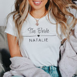 Camiseta Brida personalizada del equipo del partido Bachelo<br><div class="desc">Presentamos nuestra camiseta personalizada de novias Team Bride - la combinación perfecta de estilo, celebración y personalización para su inolvidable fiesta de soltera! Sumérgete en la alegría de ser parte del escuadrón de novias con estos camisetas especialmente hechos que son tan únicos como tu vínculo. Diseñados con un motivo cardíaco,...</div>