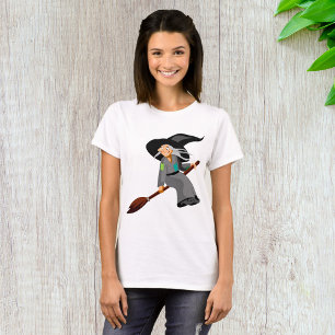 Camiseta Bruja de dibujos animados caprichosa volando en es