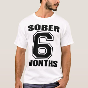 CAMISETA CALME 6 MESES DE NEGRO EN EL TANQUE BLANCO