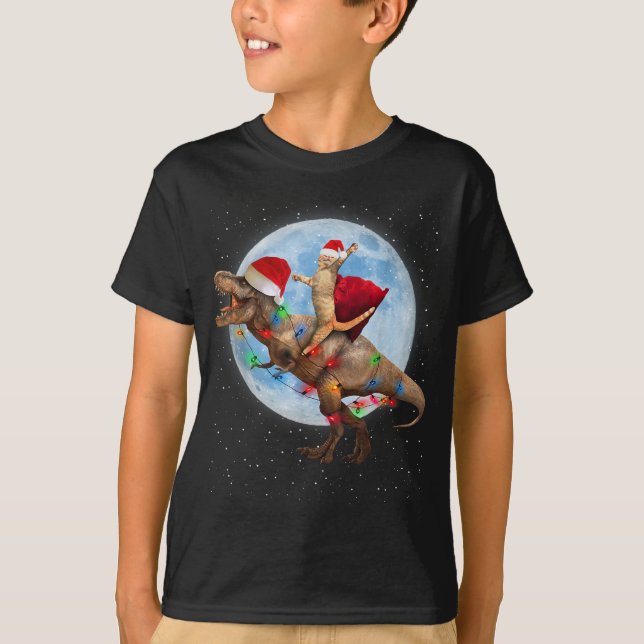 Camiseta Cat Santa Hat Riding Dinosaur T rex Moon Navidades (Anverso)