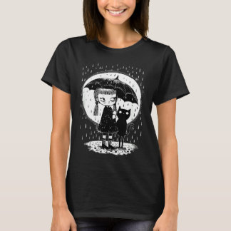Camiseta Chica de pie en la lluvia con un gato extraño en u