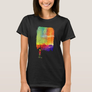 Camiseta Chica pinta una foto de Safari en la pared con ele