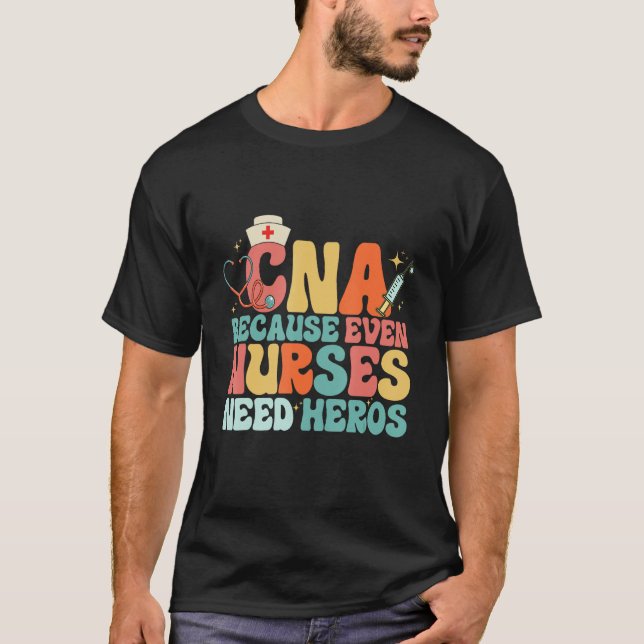 Camiseta CNA Humor Because Even Nurses Need Heroes  Nurse T (Anverso)