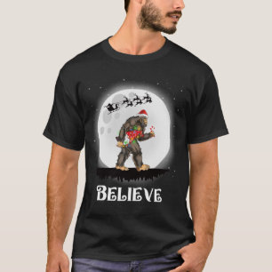 Camiseta Creer Santa Bigfoot llevando Navidades de Gnome