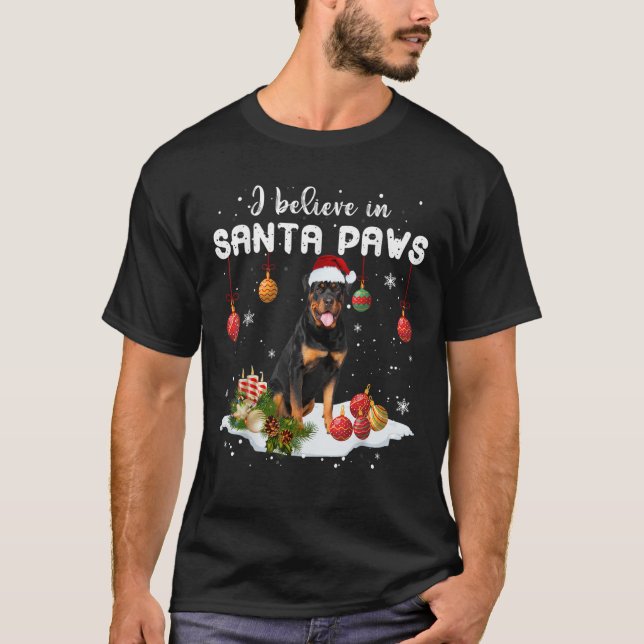 Camiseta Creo En Los Navidades De Santa Paws Rottweiler Xma (Anverso)