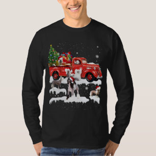 Camiseta Creste chino montando camioneta roja Feliz Navidad