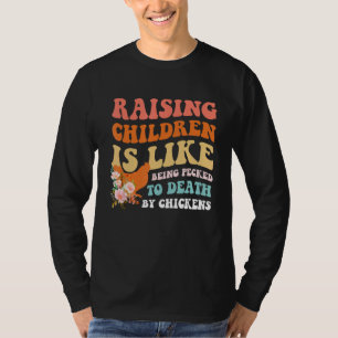 Camiseta Criar a los niños es como ser picoteado hasta la m
