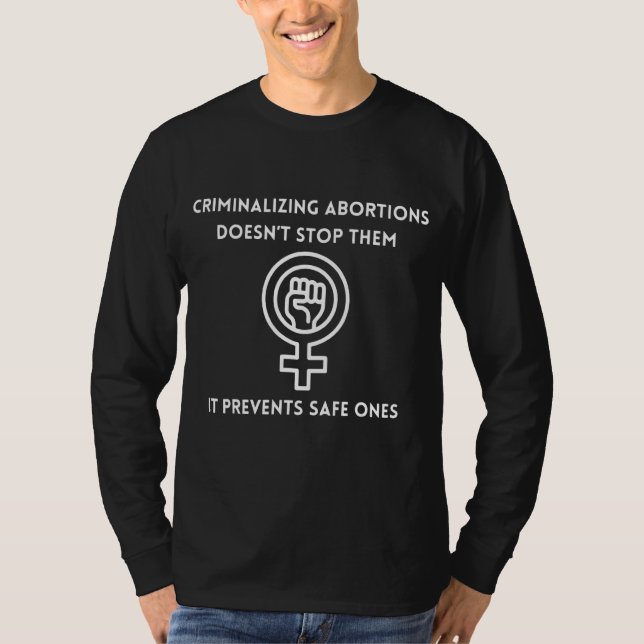 Camiseta Criminalizar no los detiene, impide que sea seguro (Anverso)