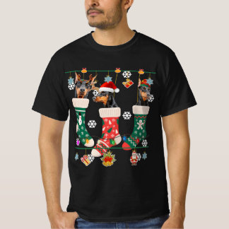 Camiseta Cuidados Navidades Doberman en regalo de Papá Noel