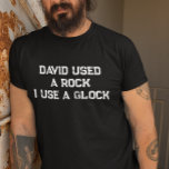 Camiseta David usó una roca que uso un reloj<br><div class="desc">Este diseño puede ser personalizado en el área proporcionada cambiando la foto y/o el texto. O puede personalizarse haciendo clic en Personalizar esta plantilla y, a continuación, eligiendo la opción de hacer clic en el personalizar y eliminando o cambiando el color del fondo, agregando texto, cambiando el color o estilo...</div>