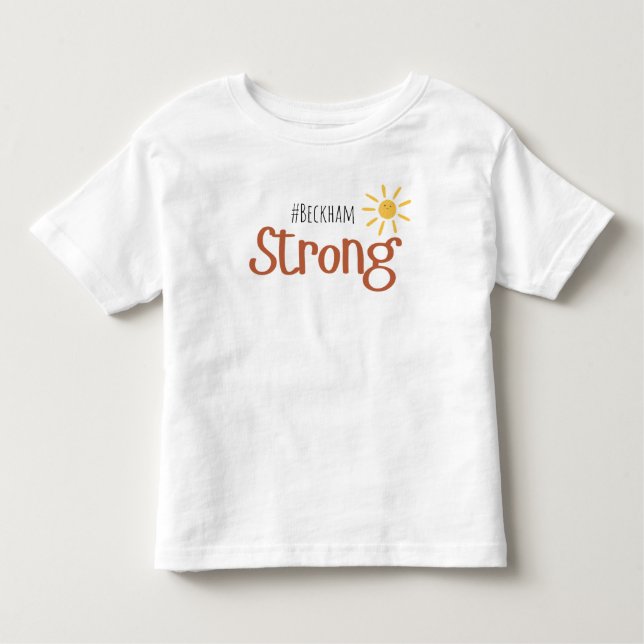 Camiseta De Bebé cáncer infantil de nombre fuerte Toddler T-Shirt (Anverso)