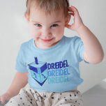 Camiseta De Bebé Dreidel Hanukkah Toddler<br><div class="desc">Dreidel dreidel dreidel en tres tonalidades diferentes de azul con un dreidel azul para Chanukah.</div>