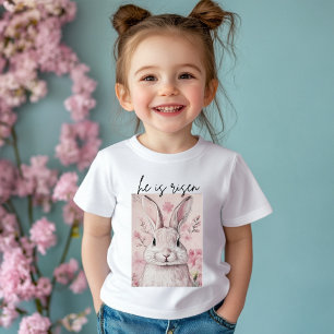 Camiseta De Bebé "Él ha Resucitado" Conejo Rosa con Flor