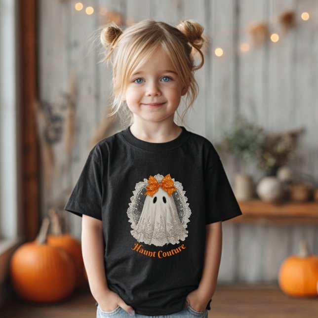 Camiseta De Bebé Haunt Couture Lace Ghost in Orange Bow (Girl with blond pigtails wearing a black T-shirt with a ghost &"Haunt Couture".)
