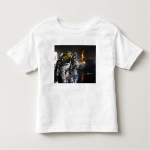 Camiseta De Bebé Los bomberos extinguen un incendio en un entrenami
