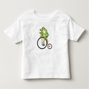 Camiseta De Bebé Rana en circo con bicicleta.PNG