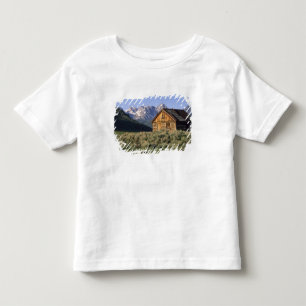 Camiseta De Bebé Una cabaña de troncos y las montañas Sawtooth en