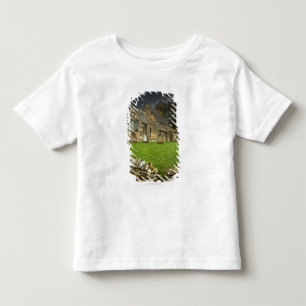 Camiseta De Bebé Una iglesia vieja debajo de un cielo oscuro