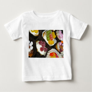 Camiseta del bebé del surtido de la magdalena