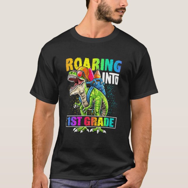 Camiseta Dinosaurio de primer grado vuelve a la mochila esc (Anverso)