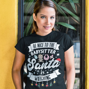 Camiseta Diversión Sé amable con la niñera que Santa está m