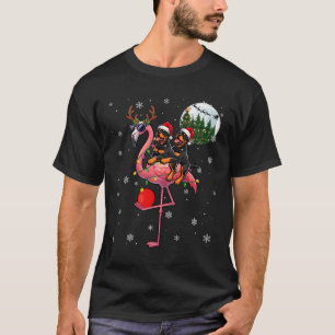 Camiseta Dos rottweilers navideños montando reno flamenco