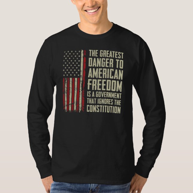 Camiseta El Mayor Peligro Para La Libertad Estadounidense - (Anverso)