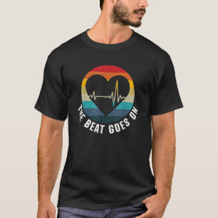 Camiseta El Ritmo Continúa Superviviente de Ataque al Coraz