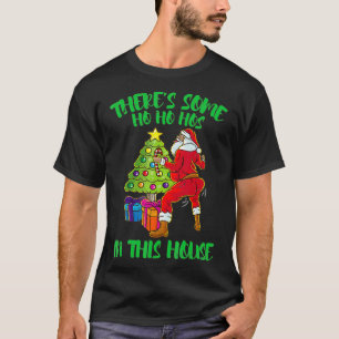 Camiseta En esta casa hay algo de Ho Ho Hos Santa Claus T